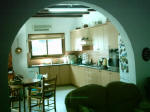 The kitchen come dinning room boasts a lovely arch way. - click to enlarge