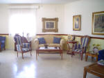 The upstairs of this double house for sale in Larnaca has a spacious living room.