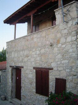 One bedroom illage house for sale in Lofou village in Cyprus. - Traditional beamed ceilings and a balcony off of the bedroom that overlooks the village walkway below.