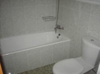 One bedroom flat on a small complex in Oroklini, near Larnaca in Cyprus for sale with fully tiled bathroom.